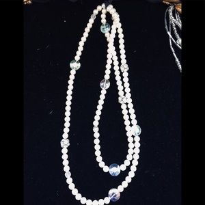 Single long strand pearls can double necklace